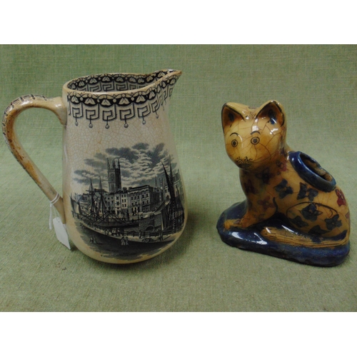 71 - Antique transfer jug and a pottery cat figure (2).