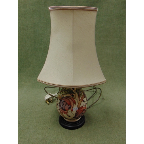 72 - Moorcroft floral decorated table lamp and shade. 17.5