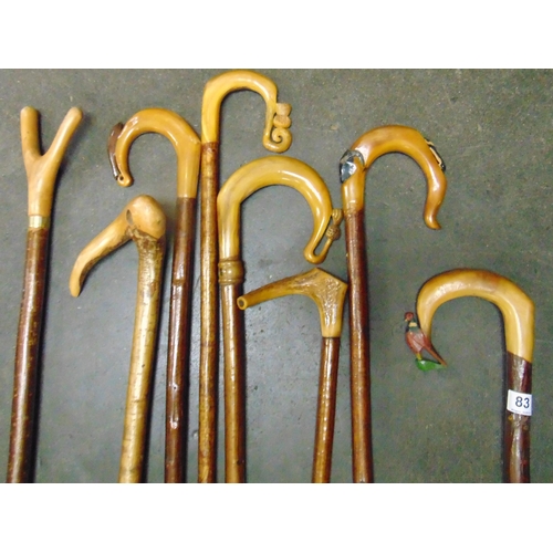 83 - Good collection of horn handled walking sticks.