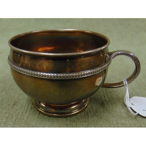 2 - Silver cup, having loop handle and on footed base. 3.2 ozt.