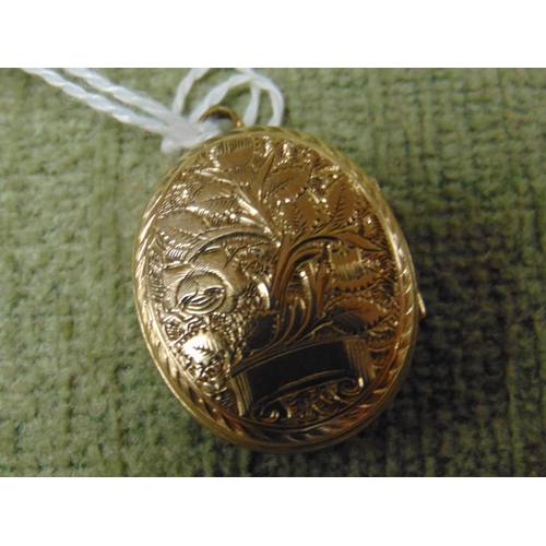 20 - Possibly gold locket.