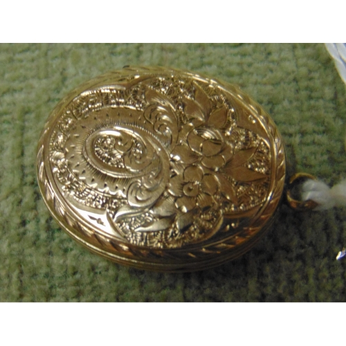 20 - Possibly gold locket.