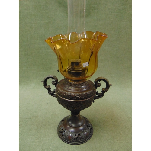 28 - 'New Rochester' oil lamp, having amber glass shade. 24