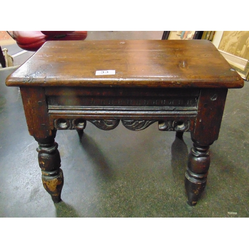 33 - Antique oak stool, having rectangular top and on short turned supports. 14 x 18 x 10