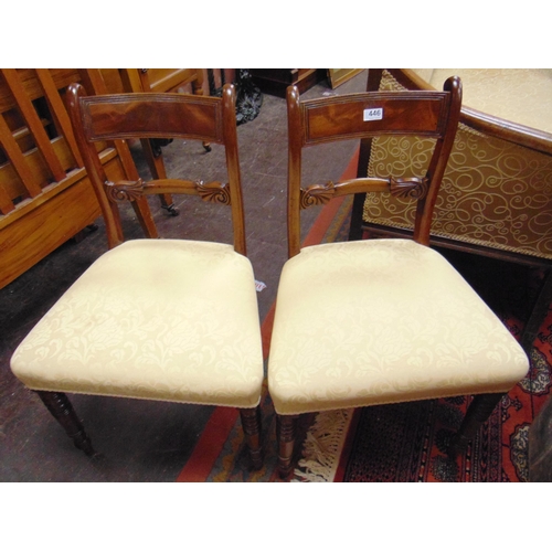 446 - Pair of Regency mahogany chairs, upholstered seats and on turned frontal supports.