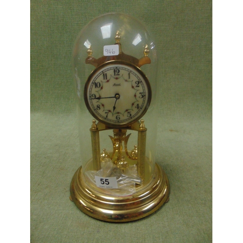 55 - Annual dome cased anniversary clock, having Arabic numerals. 12