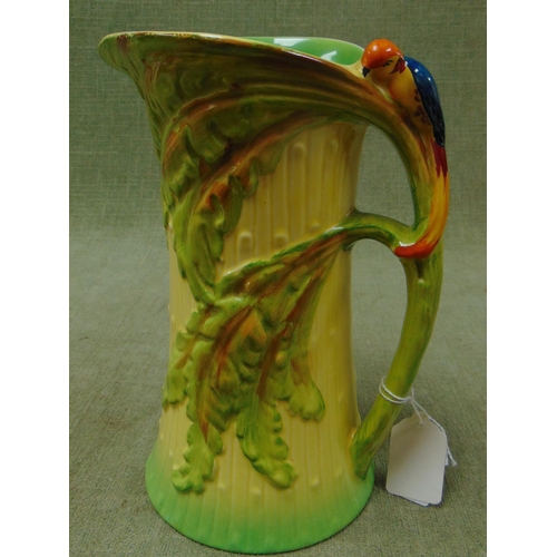 59 - Burleigh ware jug, having branch form handle and moulded parrot decoration. 9