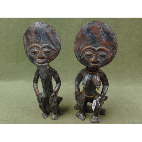 61 - Pair of African fertility figures, each 16