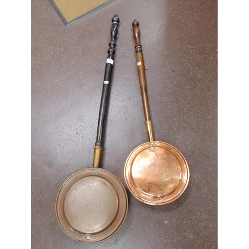 11 - Two antique copper warming pans.