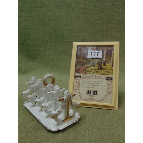 117 - Continental toast rack and a calendar print. (2).