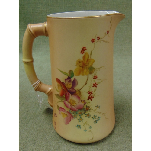 120 - Royal Worcester gilt edged jug, having faux bamboo handle and floral decoration. 7