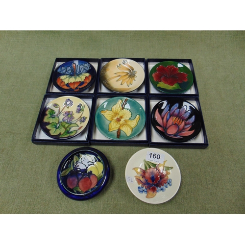 160 - Six boxed Moorcroft pin dishes, and two bowls (f).