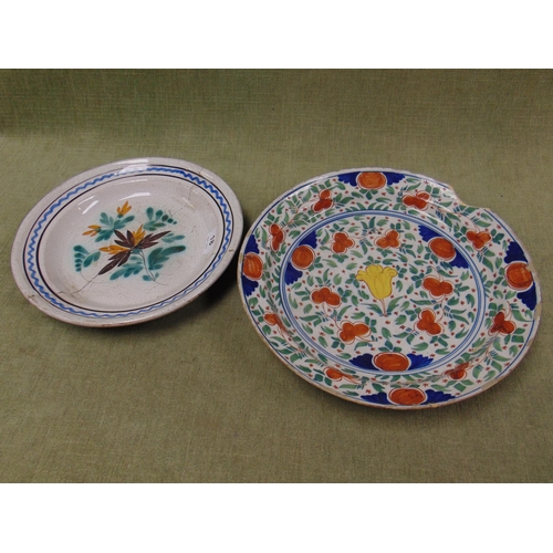 18 - Antique tin glazed charger, having hand painted decoration and one other example, both for restorati... 