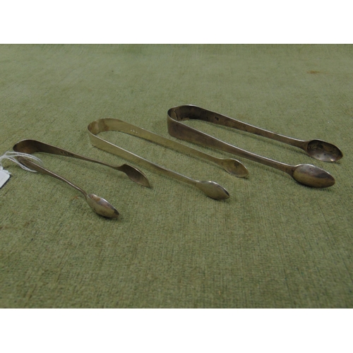 24 - Three pairs of antique silver sugar tongs, 2.7 ozt.