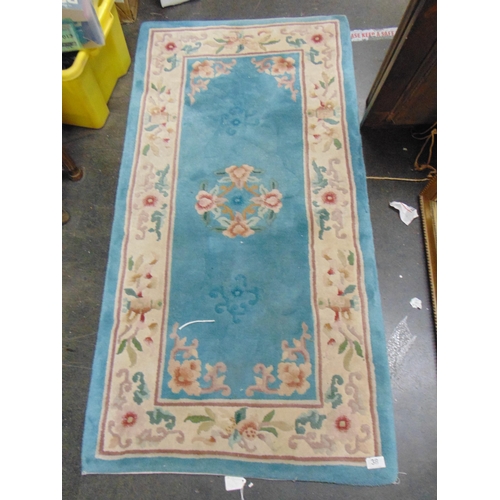 38 - Modern  Chinese rectangular rug, having floral decoration, 55 x 28