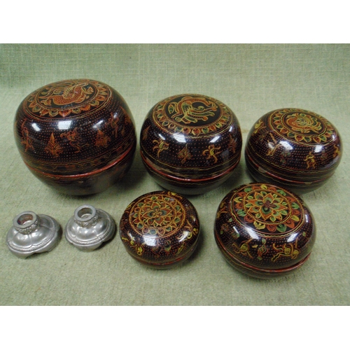 44 - Graduated set of lacquered lidded bowls, and a pair of miniature candle holders by Just Andersen.