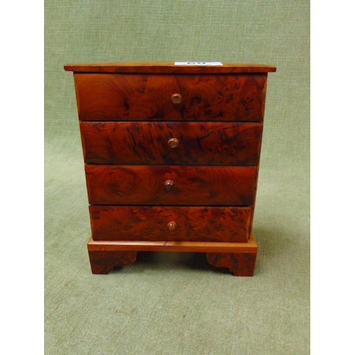 60 - Burr walnut miniature four drawer table top chest, on bracket feet. 8 x 6.5 x 4