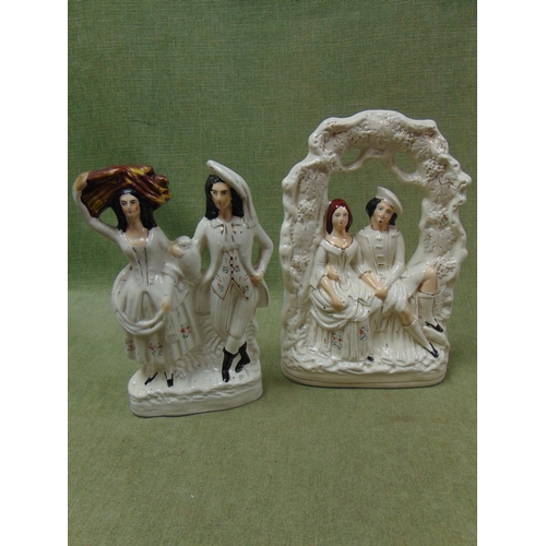 66 - Two 19th century Staffordshire figure groups.