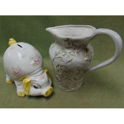 253 - Novelty pig money box and a studio jug (2).