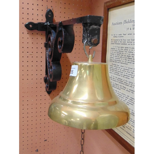 255 - Brass bell set on a cast iron bracket.