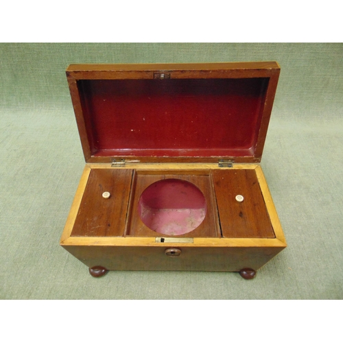 57 - Antique inlaid mahogany sarcophagus form tea caddy, lift up lid , fitted interior and on bun feet. 7... 