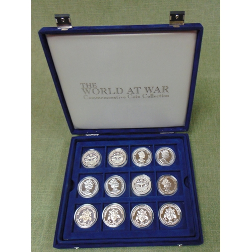 113 - Cased collection of World at War Crowns , half crowns.