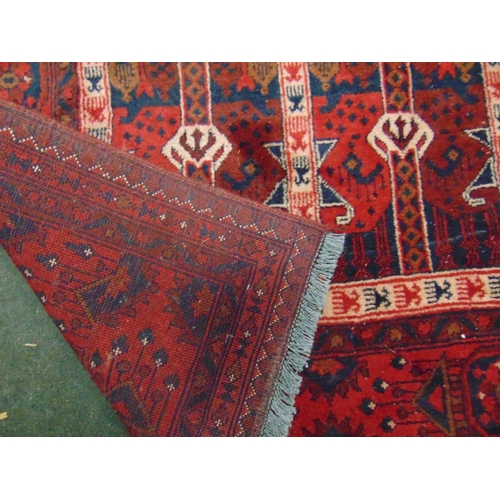 148 - Persian red ground rug, having geometric pattern. 91 x 61