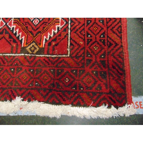 151 - Persian red and cream ground rug, having geometric pattern. 70 x 40