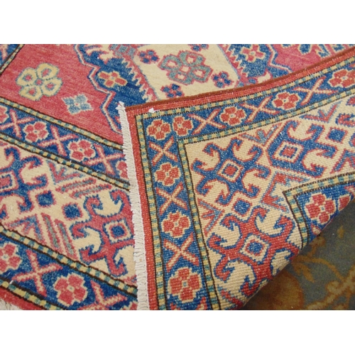 208 - Persian red, blue and yellow ground rug, having geometric pattern. 63 x 42.5