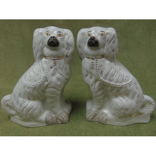 267 - Pair of 19th century Staffordshire spaniels. each 14