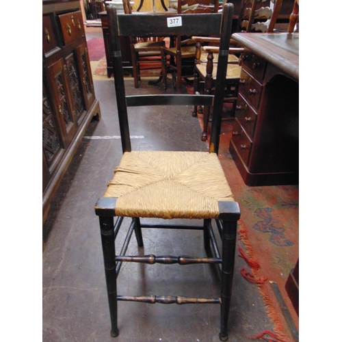 377 - Ebony rush seated high chair.