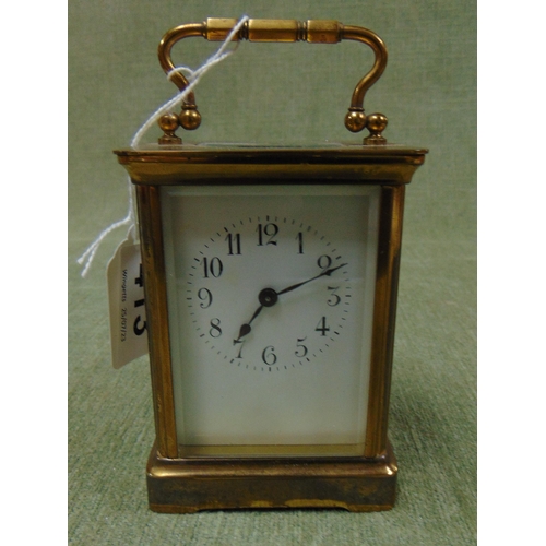 413 - Small French carriage clock, having Arabic numerals.