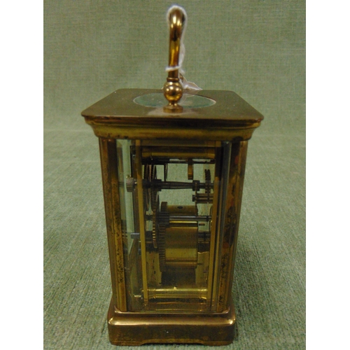 413 - Small French carriage clock, having Arabic numerals.