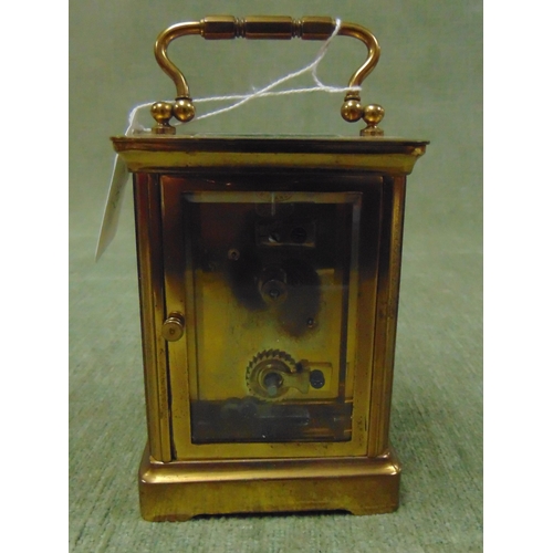 413 - Small French carriage clock, having Arabic numerals.