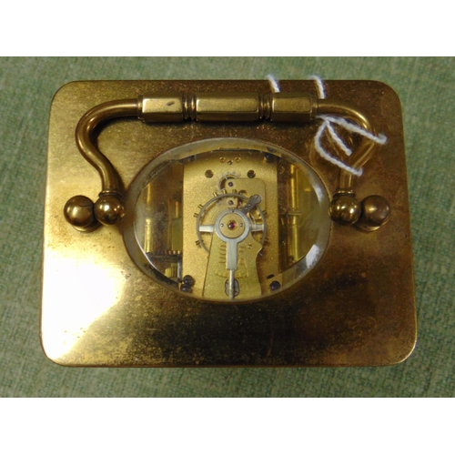 413 - Small French carriage clock, having Arabic numerals.