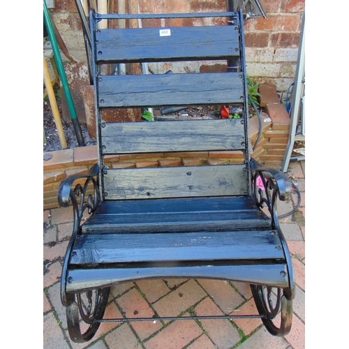 460 - Wooden slatted garden rocking chair.