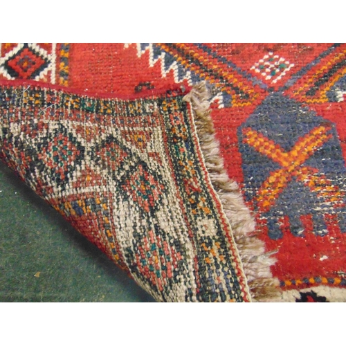 119 - Persian red ground rug, having geometric pattern, 95 x 64