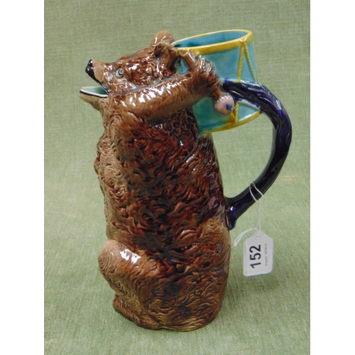 152 - Joseph Holdcroft English bear jug, modelled holding a drum aloft and forming the handle. 9.5