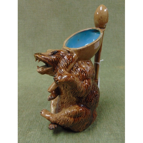 153 - Joseph Holdcroft English majolica Bear form syrup jug, having spoon form handle. 9