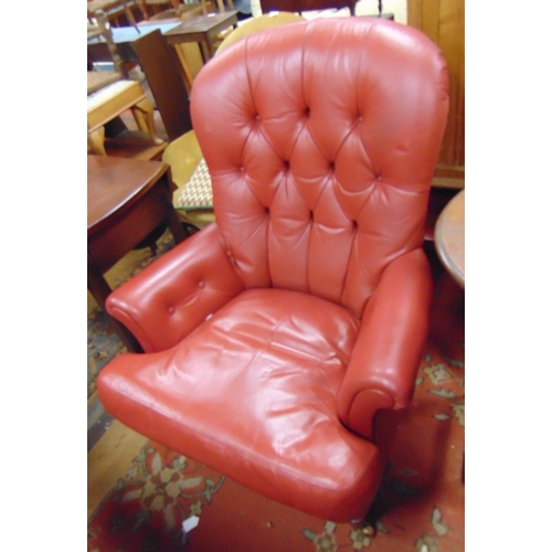 248 - Antique style button back chair, all over red upholstery, on short turned supports and castors.