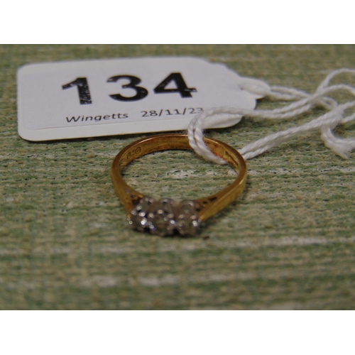 134 - 18 ct gold ring, set with three diamonds, size M.