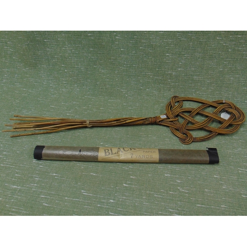 16 - Wicker carpet beater together with 7 yards of APR Blackout paper.