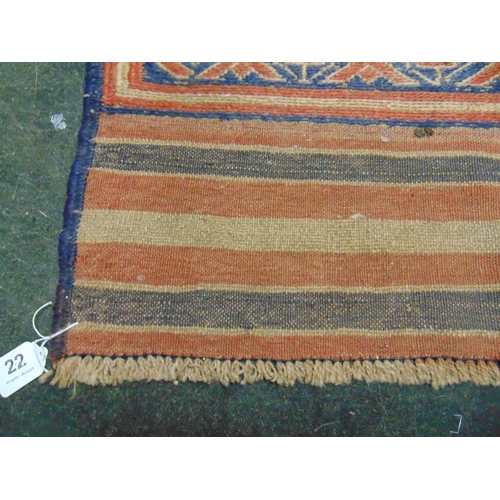 22 - Persian blue and red ground rug, having floral pattern. 49 x 28