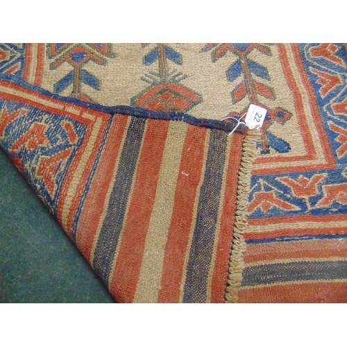 22 - Persian blue and red ground rug, having floral pattern. 49 x 28