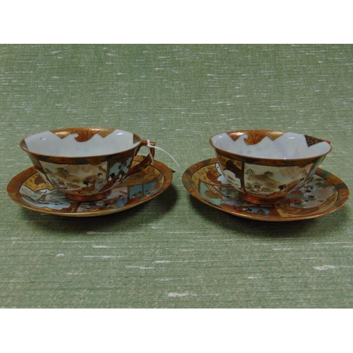 30 - Pair of oriental eggshell tea cups and saucers, having traditional decoration and character marks to... 