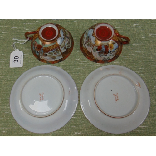 30 - Pair of oriental eggshell tea cups and saucers, having traditional decoration and character marks to... 