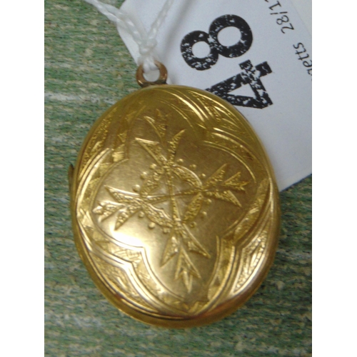 48 - Possibly gold morning locket, having engraved decoration.