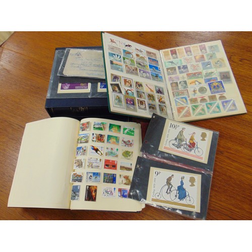 43 - Five albums containing a collection of stamps.