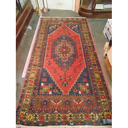 24 - Persian red and blue ground rug, having geometric pattern, 97 x 49