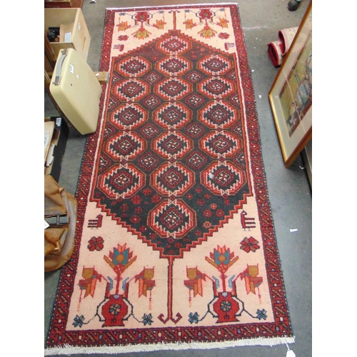 25 - Persian red ground rug, having geometric pattern, 78 x 34